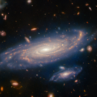 Photograph of a spiral galaxy, captured by the James Webb Space Telescope